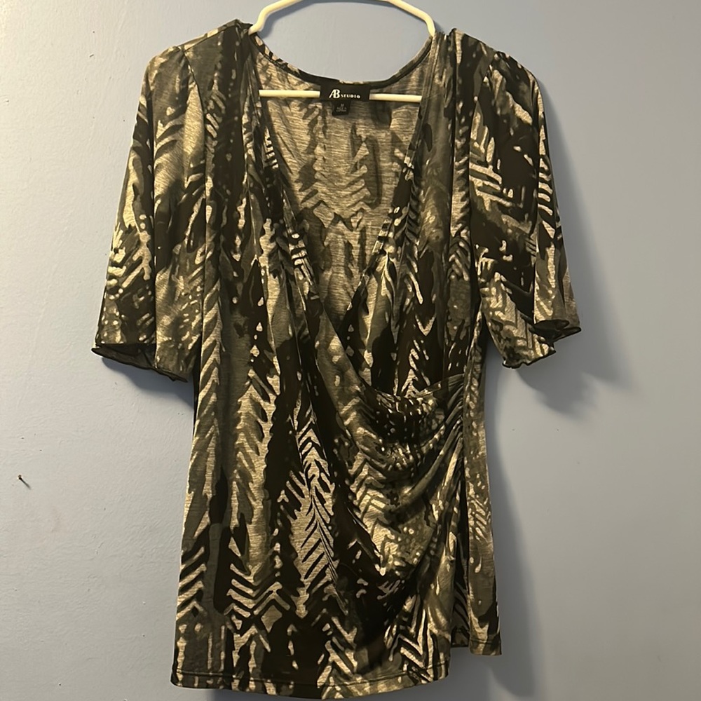 Women’s size Medium black, grey and white front cross cross blouse.